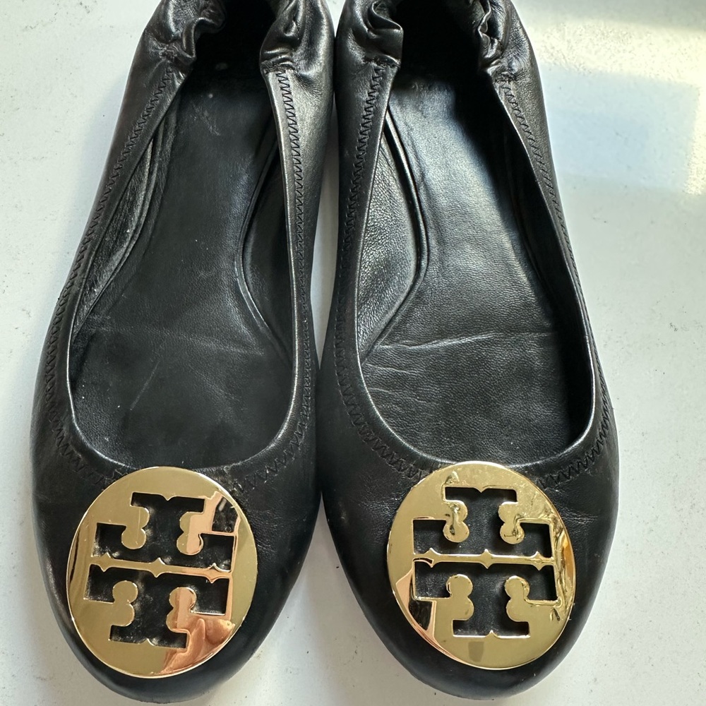 Tory Burch Black and Gold Flats with Signature Emblem